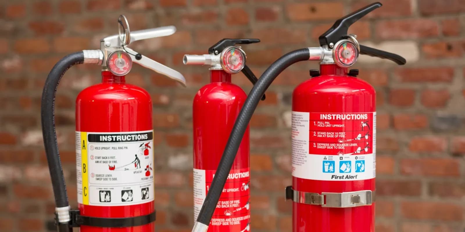 Red fire extinguisher mounted on wall